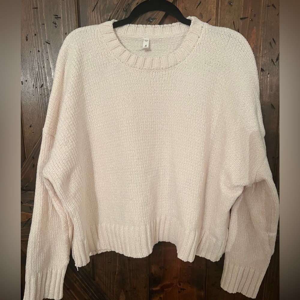 Cream colored cropped soft crewneck sweater